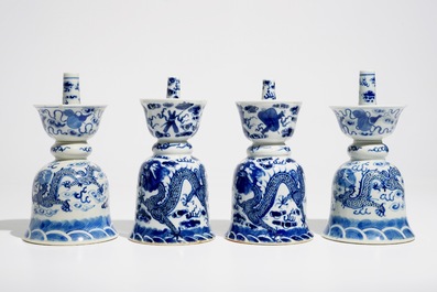 Two pairs of Chinese blue and white candlesticks with dragons, 19/20th C.