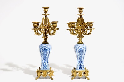 A pair of Chinese blue and white gilt bronze-mounted candelabra vases, Kangxi