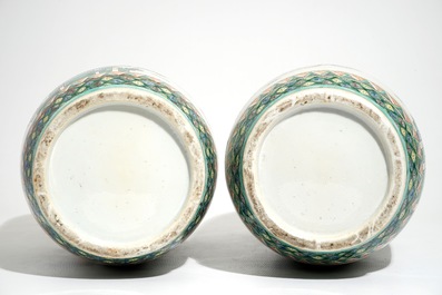 A pair of tall Chinese famille verte vases with court scenes, 19th C.