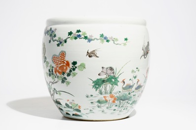 A Chinese famille verte fish bowl with a phoenix and mandarin ducks, 19th C.