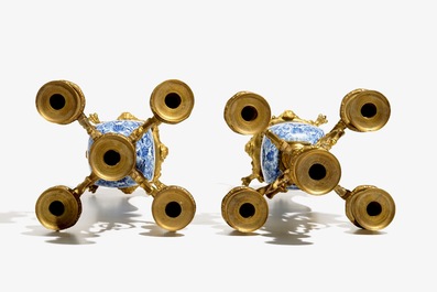 A pair of Chinese blue and white gilt bronze-mounted candelabra vases, Kangxi