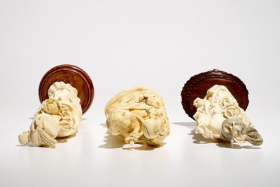 Two Chinese carved ivory figures of Guanyin and a Japanese okimono, 19/20th C.