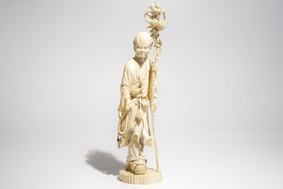 A tall Chinese ivory model of an immortal, late 19th C.