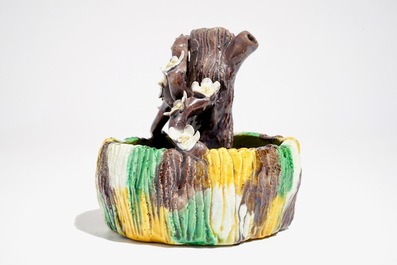 A Chinese verte biscuit brushwasher modelled as a treetrunk, Kangxi
