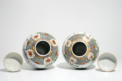 A pair of Chinese famille verte covered jars with figural design, 19th C.