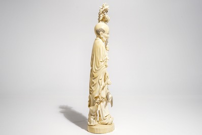 A tall Chinese ivory model of an immortal, late 19th C.