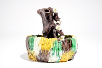A Chinese verte biscuit brushwasher modelled as a treetrunk, Kangxi