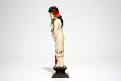 A Chinese polychrome ivory figure on wooden stand, 2nd quarter 20th C.