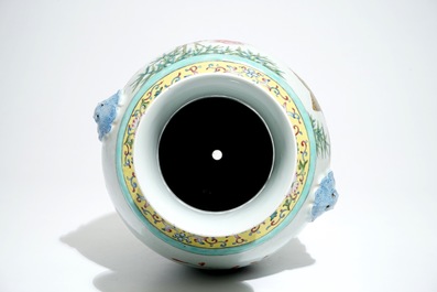 A Chinese famille rose hu vase with birds among flowers on rockwork, Qianlong mark, 19/20th C.