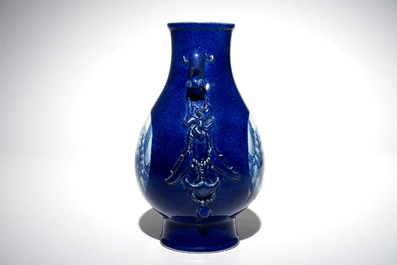 A Chinese blue and white hu powder blue-ground vase with landscape medallions, Qianlong mark, 19/20th C.