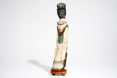 A tall Chinese polychrome ivory model of a lady with removable head, 19th C.