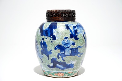 A Chinese famille verte jar with wooden cover and stand, Kangxi