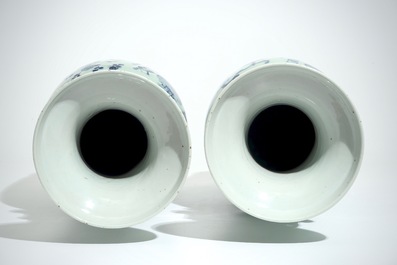 A pair of tall Chinese blue and white on celadon-ground vases, 19th C.