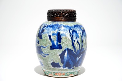 A Chinese famille verte jar with wooden cover and stand, Kangxi