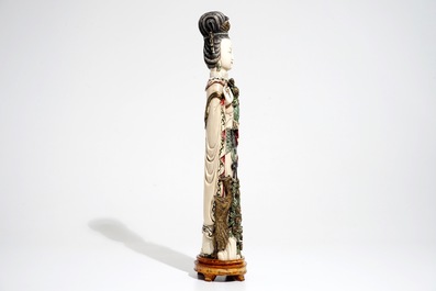 A tall Chinese polychrome ivory model of a lady with removable head, 19th C.