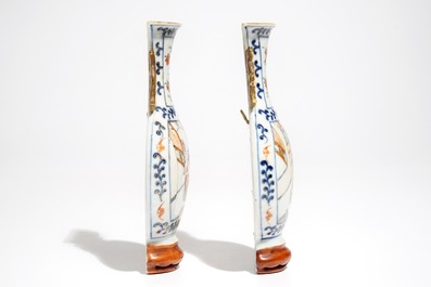 A pair of Chinese famille rose wall vases with figural design, 19th C.
