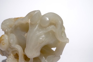 A Chinese white jade carving of a "Three rams" group, 19/20th C.