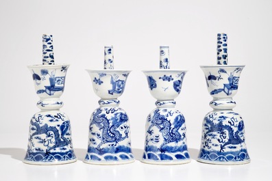 Two pairs of Chinese blue and white candlesticks with dragons, 19/20th C.
