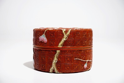 A Chinese porcelain imitation lacquerware covered box with prunus branches, 19/20th C.