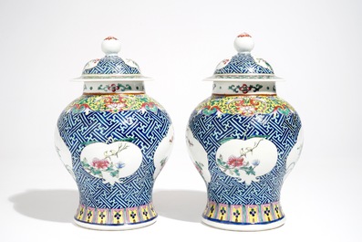A pair of Chinese famille rose vases and covers, 19th C., and a pair of blue and white dishes, 20th C.