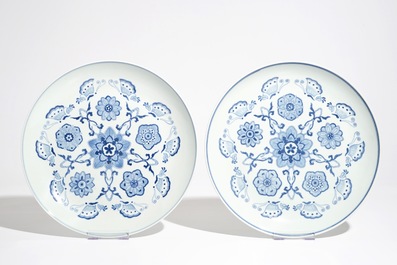 A pair of Chinese famille rose vases and covers, 19th C., and a pair of blue and white dishes, 20th C.