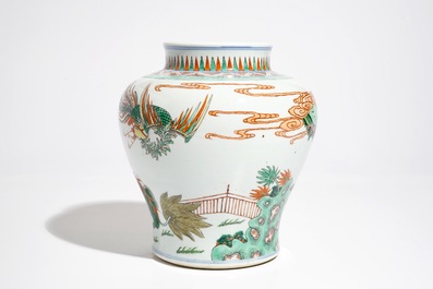 A Chinese wucai baluster vase with a kylin and a phoenix, 19th C.