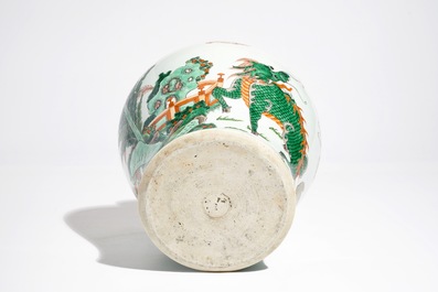A Chinese wucai baluster vase with a kylin and a phoenix, 19th C.