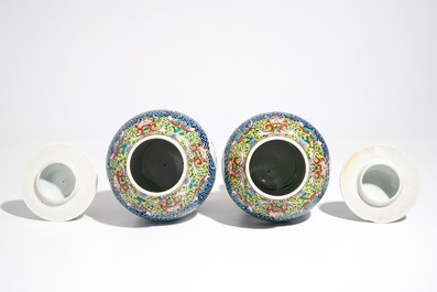 A pair of Chinese famille rose vases and covers, 19th C., and a pair of blue and white dishes, 20th C.