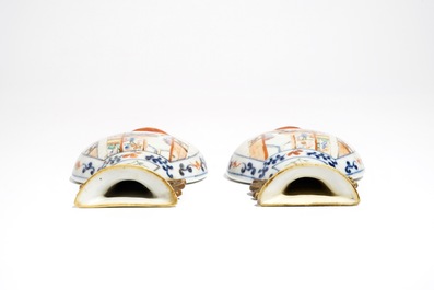 A pair of Chinese famille rose wall vases with figural design, 19th C.