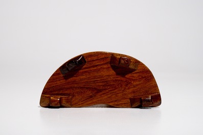 A Chinese ivory group on wooden stand, 2nd quarter 20th C.