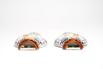 A pair of Chinese famille rose wall vases with figural design, 19th C.
