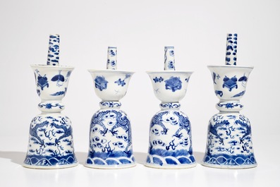 Two pairs of Chinese blue and white candlesticks with dragons, 19/20th C.