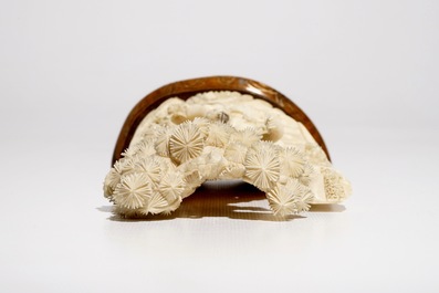 A Chinese ivory group on wooden stand, 2nd quarter 20th C.