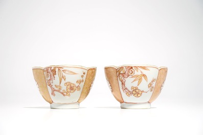 A pair of Chinese milk and blood quatrefoil cups and saucers, Kangxi
