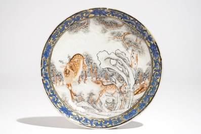 A Chinese anhua decorated cup and saucer with polychrome deer design, Yongzheng