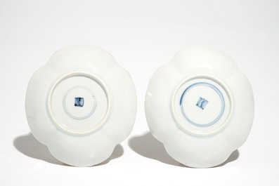 A pair of Chinese milk and blood quatrefoil cups and saucers, Kangxi