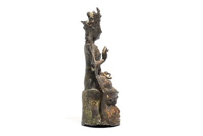 A Chinese laquered bronze figure of Guanyin, Ming