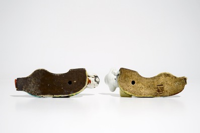 A pair of Chinese famille rose wall pocket vases shaped as resting figures, early 19th C.