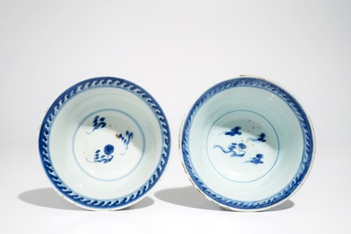 A pair of Chinese blue and white dragon bowls and a pair of Long Eliza plates, Kangxi