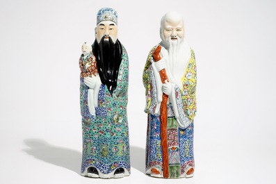 A pair of Chinese famille rose figures of immortals on wooden bases, 19/20th C.