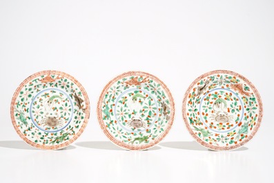 Three Chinese famille verte caf&eacute; au lait-ground cups and saucers with crabs and fish, Kangxi