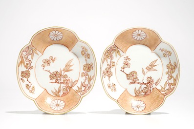 A pair of Chinese milk and blood quatrefoil cups and saucers, Kangxi
