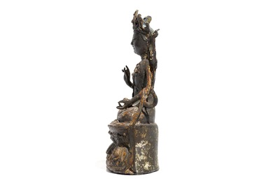 A Chinese laquered bronze figure of Guanyin, Ming
