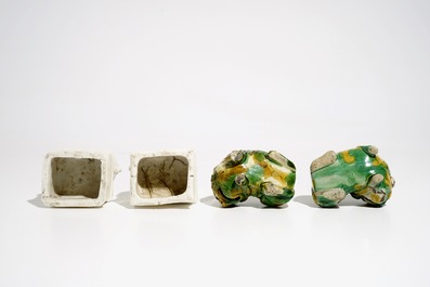 A pair of Chinese Dehua blanc de Chine Buddhist lion joss stick holders and a pair of verte biscuit dogs, Kangxi