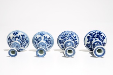 Four small Chinese blue and white floral candlesticks, Kangxi