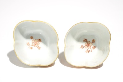 A pair of Chinese milk and blood quatrefoil cups and saucers, Kangxi
