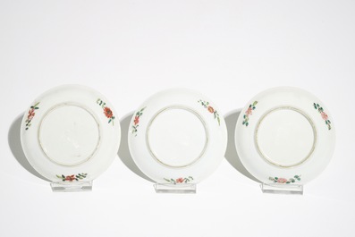 Two Chinese famille rose cups and three saucers with floral design, Yongzheng/Qianlong