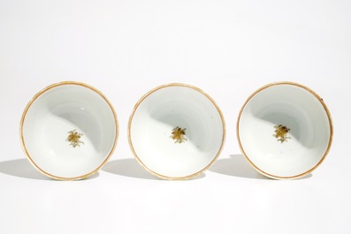 Three Chinese famille rose and gilt cups and saucers, Yongzheng/Qianlong