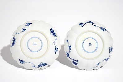 A pair of Chinese blue and white cups and saucers with qilin, yu mark, Kangxi