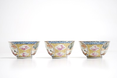Three Chinese famille rose and gilt cups and saucers, Yongzheng/Qianlong
